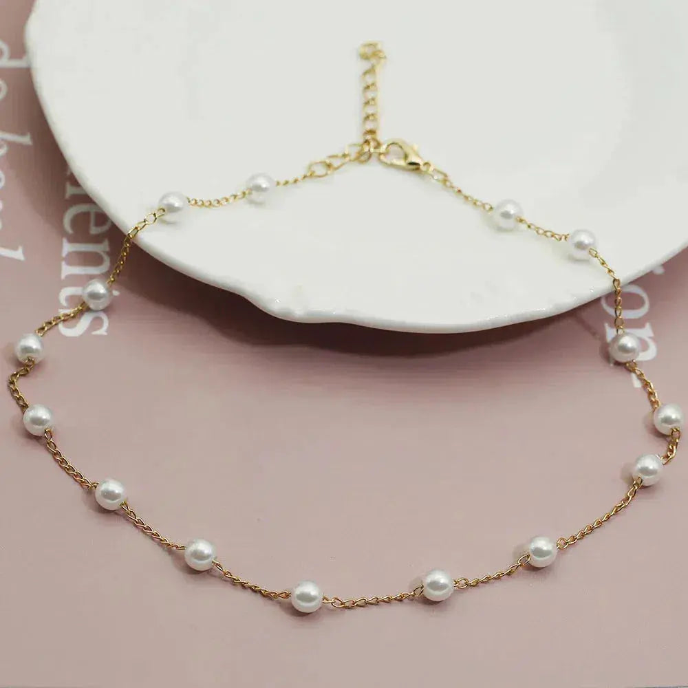Layered Gold Necklace Adorned with a Pearl Accent