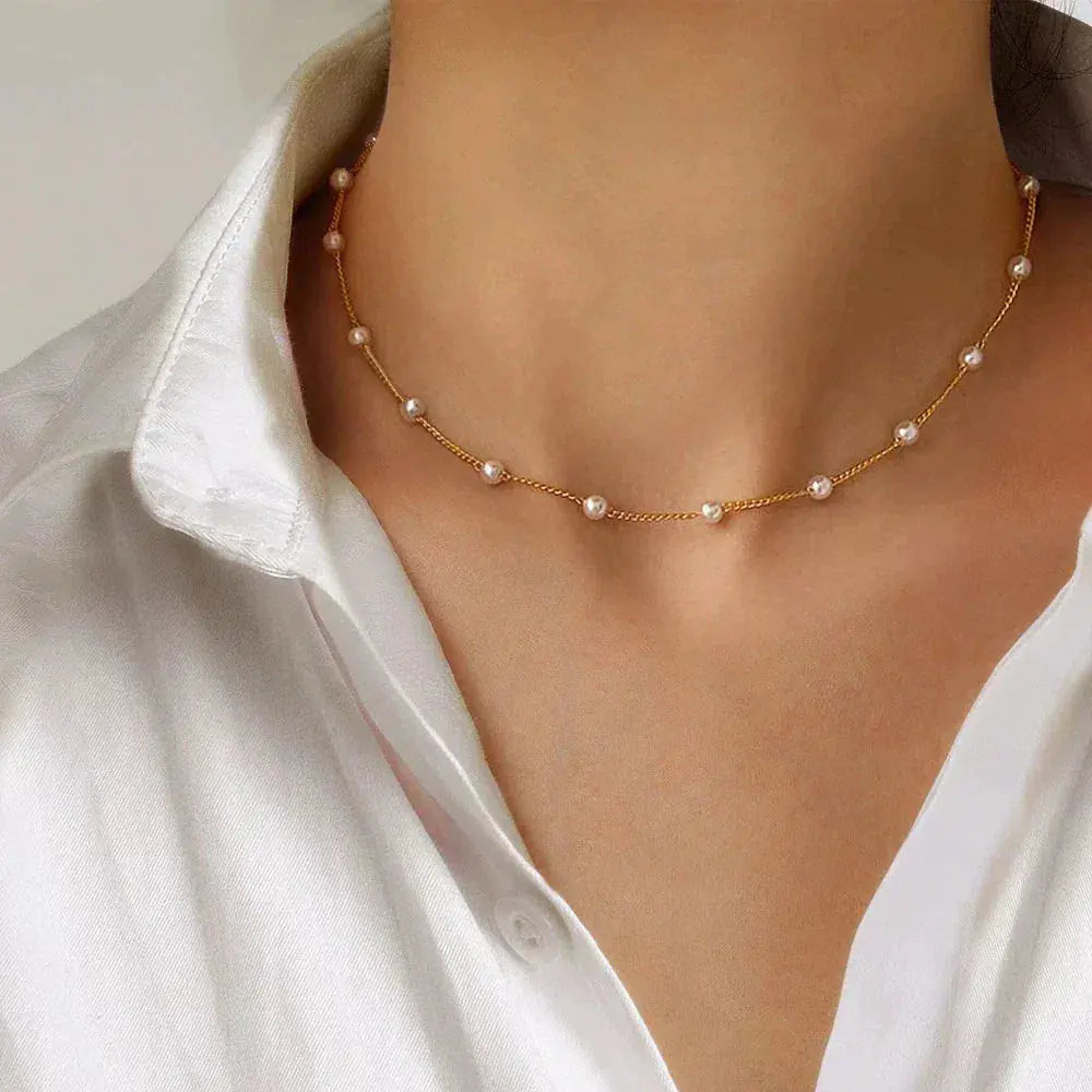 Layered Gold Necklace Adorned with a Pearl Accent